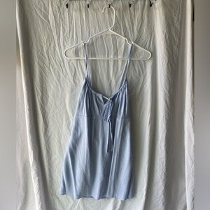 Light blue mini dress with crossed straps in back, medium, never worn